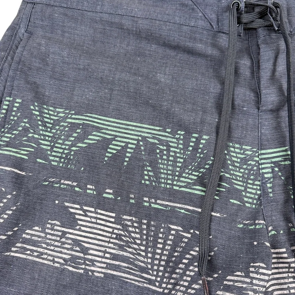 Travis Mathew Navy Blue Board Shorts with Mint and White Stripe Print